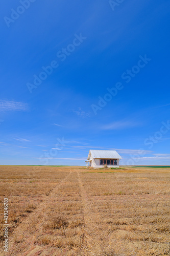 An abandoned schoolhouse in a hay field, southeastern Washington, USA