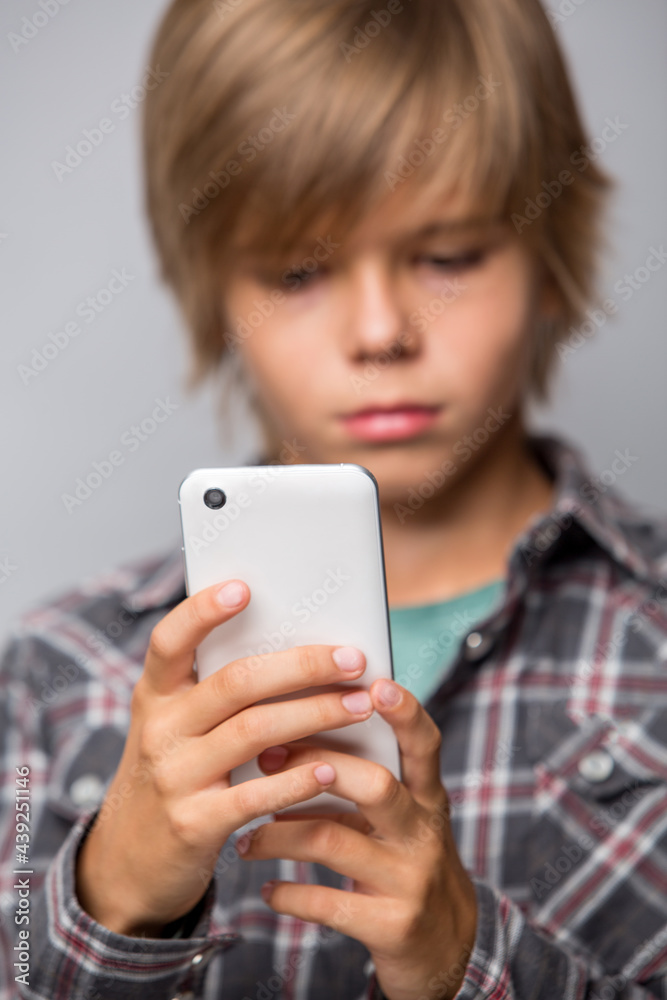 young child using mobile, focus on phone young child using mobile, focus on phone