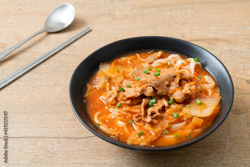 Korean udon ramen noodles with pork in kimchi soup