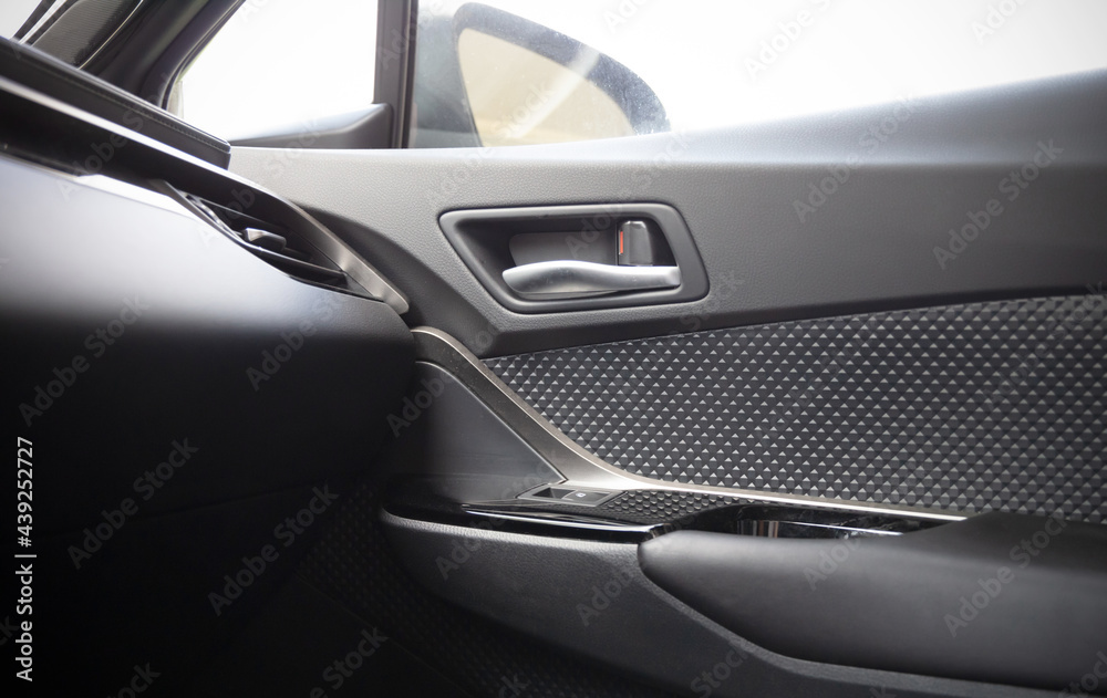 The interior of the car with a view of the passenger door