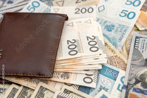 US dollar with polish zloty bills wallet business background