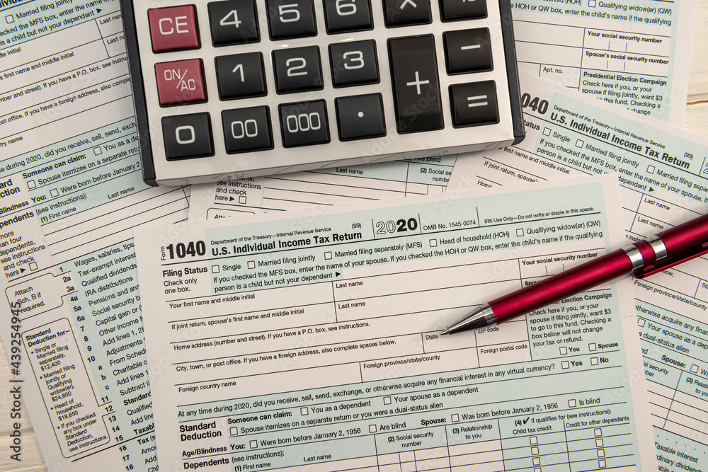 close up of empty us tax form 1040 and ballpoint pen close up of empty us tax form 1040 and ballpoint pen