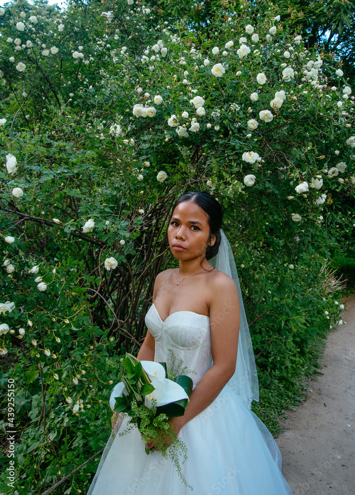 Beautiful asian vietnamese bride in white dress indoors Beautiful asian vietnamese bride in white dress indoors