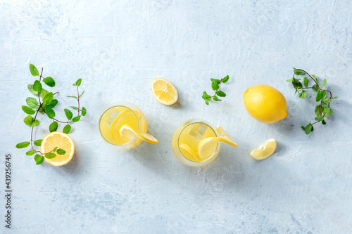 Lemonade. Homemade fresh drink with lemon and mint, with ice, overhead flat lay shot with a place for text. Healthy organic detox diet