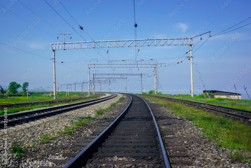 Railway track in clear weather during the day Railway track in clear weather during the day