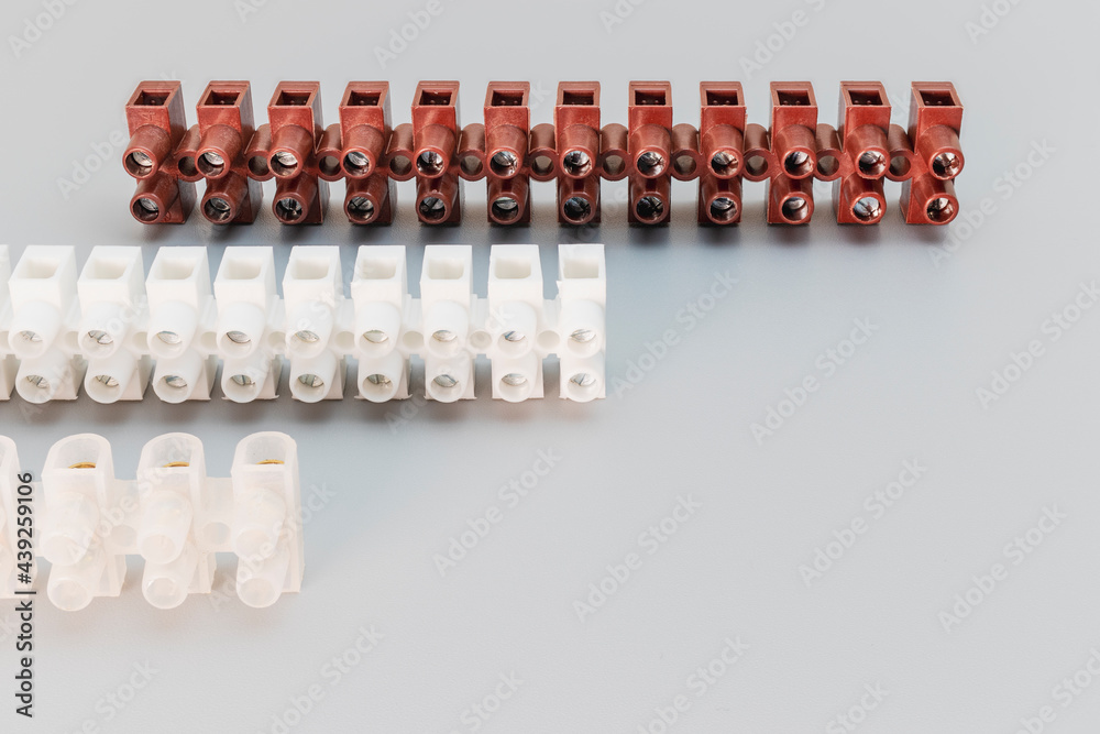 Terminal blocks and distribution blocks. Connecting electrical cables of different voltages. Connection to an electrical terminal. Electrician. Copy space Terminal blocks and distribution blocks. Connecting electrical cables of different voltages. Connection to an electrical terminal. Electrician. Copy space