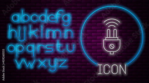 Glowing neon line Smart electric plug system icon isolated on brick wall background. Internet of things concept with wireless connection. Neon light alphabet. Vector