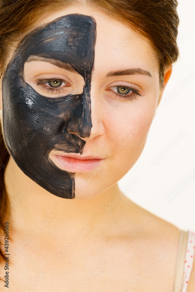 Woman with charcoal facial mask