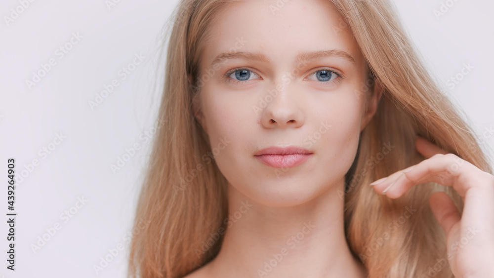 Camera tilts up from the woman's shoulder to her face. Beauty model demonstrates her perfect skin | Skincare product advertising concept. Camera tilts up from the woman's shoulder to her face. Beauty model demonstrates her perfect skin | Skincare product advertising concept.