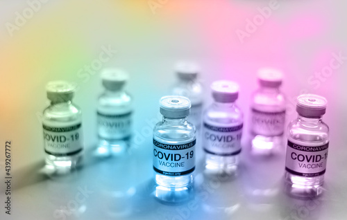 Coronavirus COVID-19 Vaccine Glass Bottle with pastel color background at Thailand. Concept viruses spread throughout the world. Selective Focus.