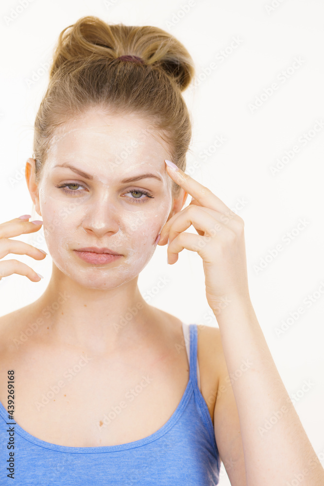Girl with cream moisture cosmetic on face Girl with cream moisture cosmetic on face