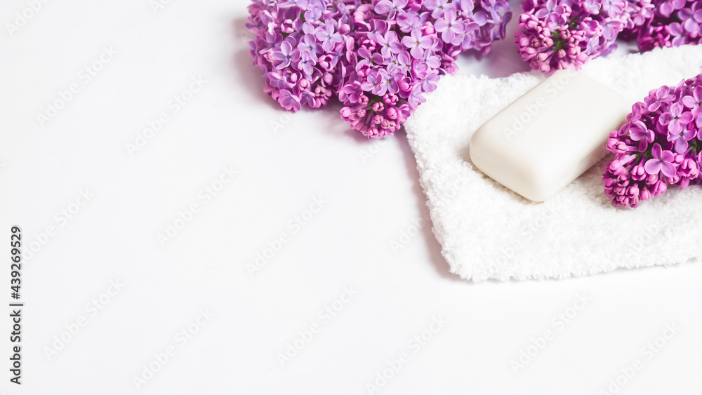 Natural bars of soap. Organic soap with lilac flowers on a white background. Skin care.