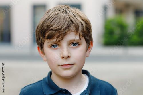 Portrait of preteen school kid boy. Beautiful happy child looking at the camera. Schoolboy smiling. Education concept. photo