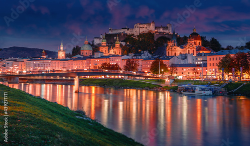 Wonderful evening scene of Salzburg city. View of the historical city  famous Hohensalzburg Fortress with reflection in the Salzach river  popular travel destination in Austria. Central Europe.