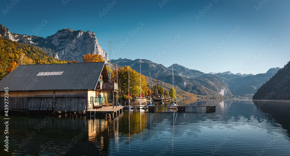Wonderful Autumn Landscape in Austrian Alps with perfect sky. Awesome Fairy tale lake at Alpine Highlands in Autumn in Sunny day . Amazing Nature Scenery. Grundlsee, Styria, Austria. Popular resort
