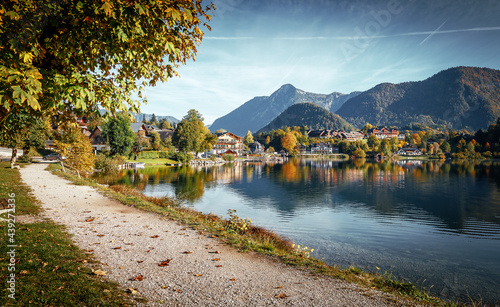 Woderful summer landscape. View on Asphalt road in Grundlsee village in Austrian Alps. Grundlsee is popular travel destination. Idea of travel on car.  Best famouse hiking locations. luxury resort photo