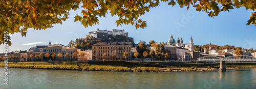 Stunning autumn view of Salzburg with famous Hohensalzburg Fortress at sunny day. Salzburg is a popular travel and hiking destination in Austria. Central Europe. Concept of an ideal resting place