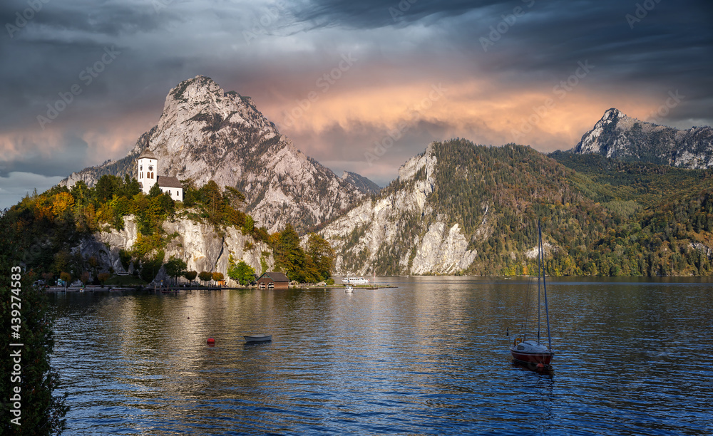 Scenic image of Stunning nature in Austrian alps. Amazing Autumn Landscape with Chapel on a rock over the Traunsee lake in the Alps of Austria. incredible natural background. Travel adventure concept