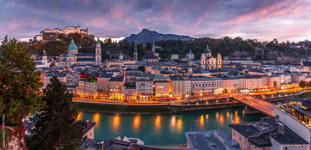 Colorful evening cityscape. Stunning view on historic city of Salzburg with famous Hohensalzburg Fortress. Wonderful autumn landscape with picturesque sky. Softlight effect. Salzburger Land, Austria