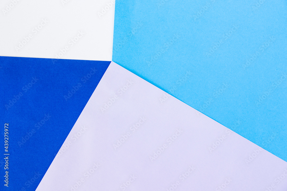Blue, white and purple paper background, paper board and geometric figures Blue, white and purple paper background, paper board and geometric figures