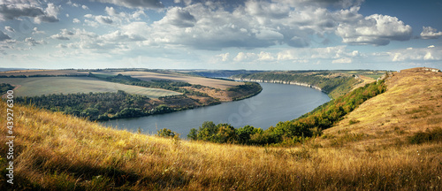 Scenic panorama view of Dnister River in Ukraine. Incredible nature landscape. Amazing autumn scenery. Majestic calm river and perfect sky  over Dnister canyon of Ukraine. Popular touristic landsmarks photo