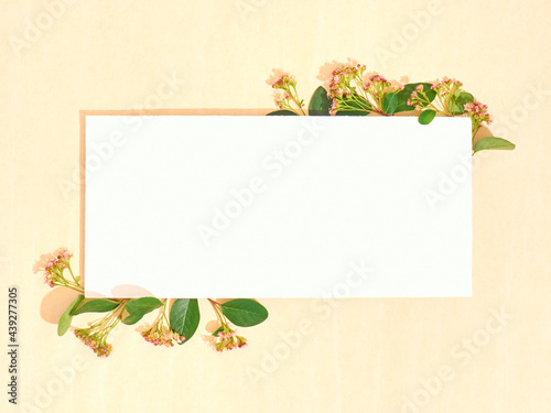 Blank paper with summer flowers. Flat lay, copy space, top view.