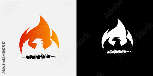 bird of prey on fire and skewer with meat, negative space. logo for barbecue