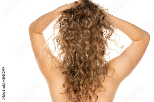 rear view of awoman with long curly blonde hair