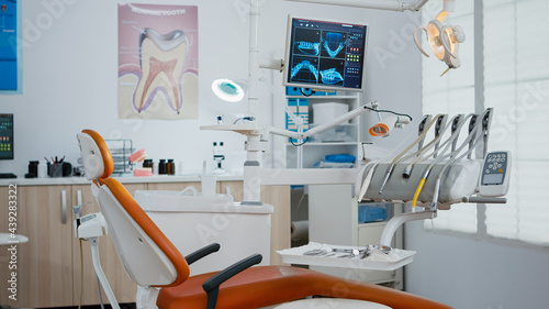 Interior of modern dental office in hospital with dentistry orthodontic furniture. Zoom in shot of professional tooth instrument. Workplace cabinet for orthodontist health, care treatment