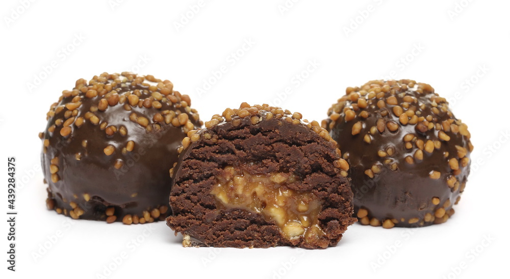 Chocolate truffles with caramel filling and peanut flavor isolated on white background Chocolate truffles with caramel filling and peanut flavor isolated on white background