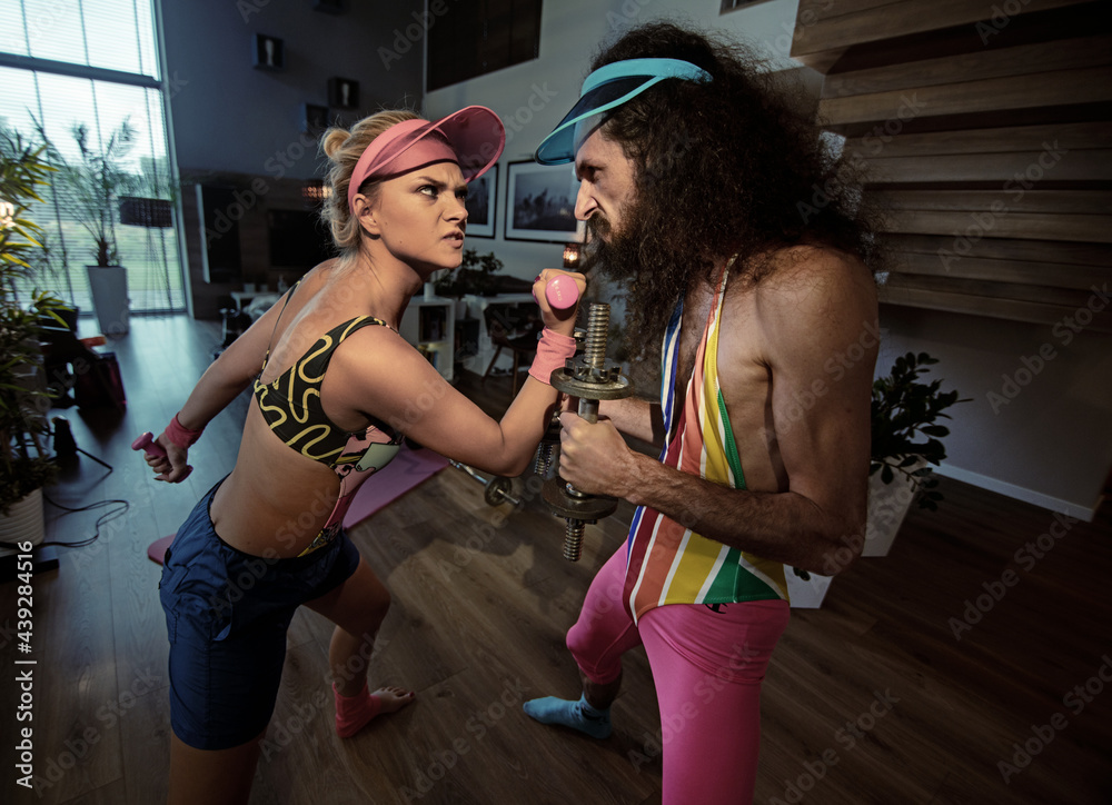 Sporty hipster couple home training