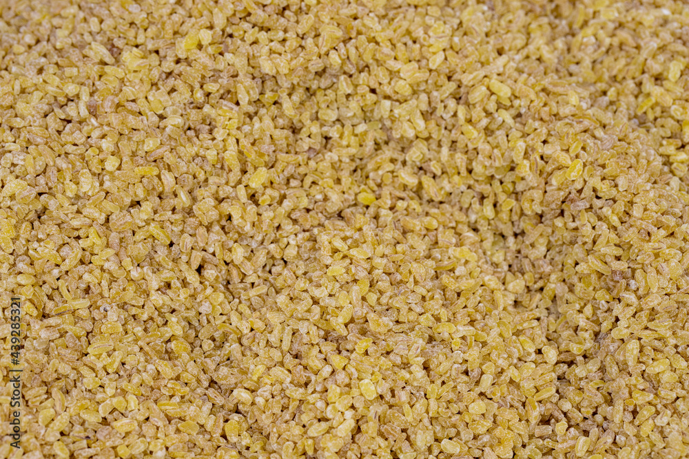 Close-up bulgur grains. Bulgur as a background texture Close-up bulgur grains. Bulgur as a background texture