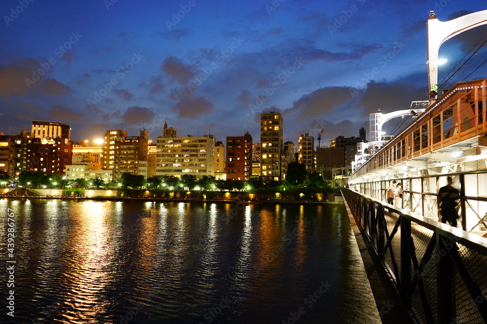 Cityscape of Sumidagawa River and Sumida River Walk Bridge at night in Tokyo, Japan - 日本 東京都 隅田川 リバーウォーク 夜景