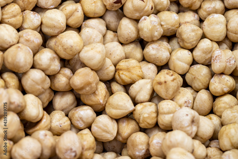 Roasted hazelnut kernels. close up. Roasted hazelnuts as background texture
