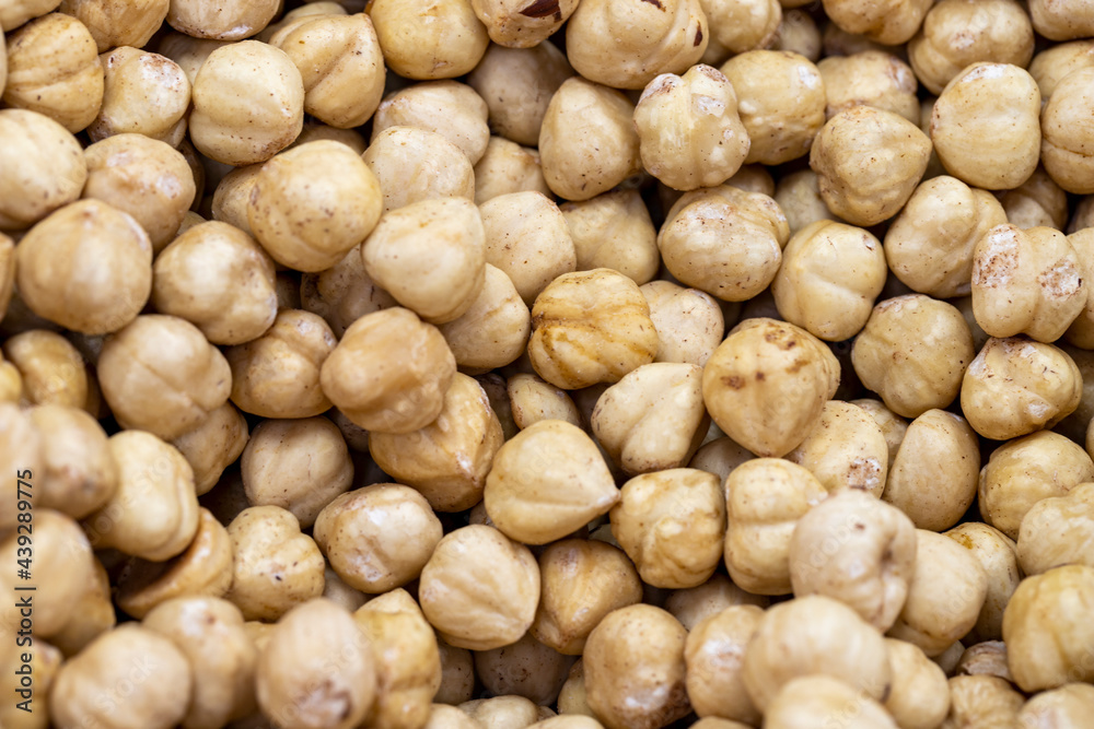 Roasted hazelnut kernels. close up. Roasted hazelnuts as background texture Roasted hazelnut kernels. close up. Roasted hazelnuts as background texture