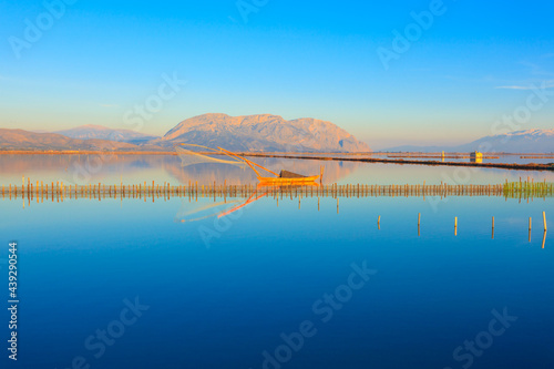 Central Greece,  wooden fishing boat view inside lake  in Tourlida Greece photo