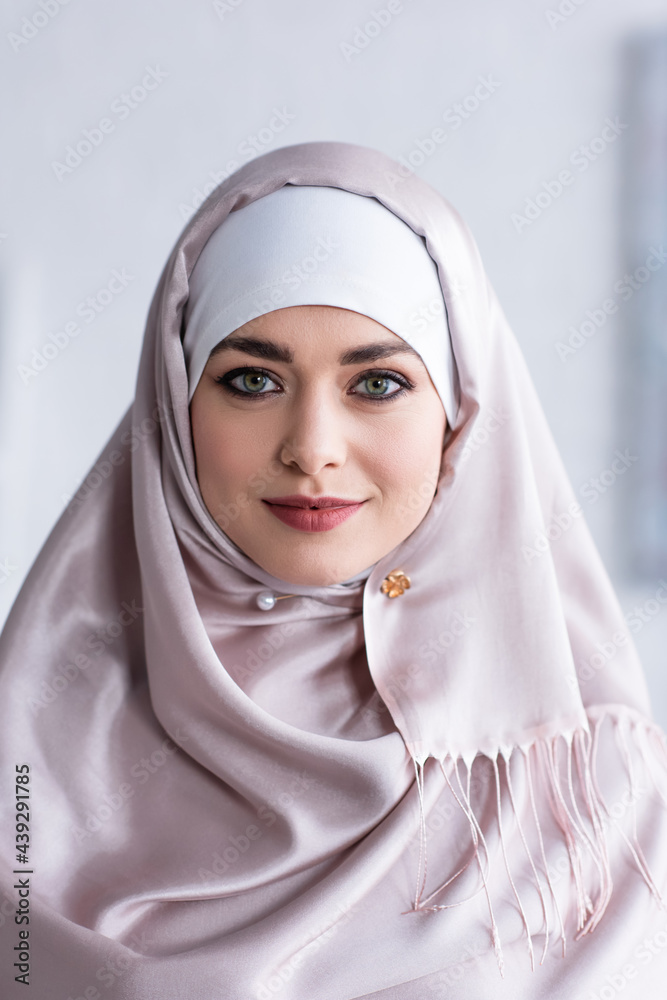portrait of pretty muslim woman smiling while looking at camera portrait of pretty muslim woman smiling while looking at camera
