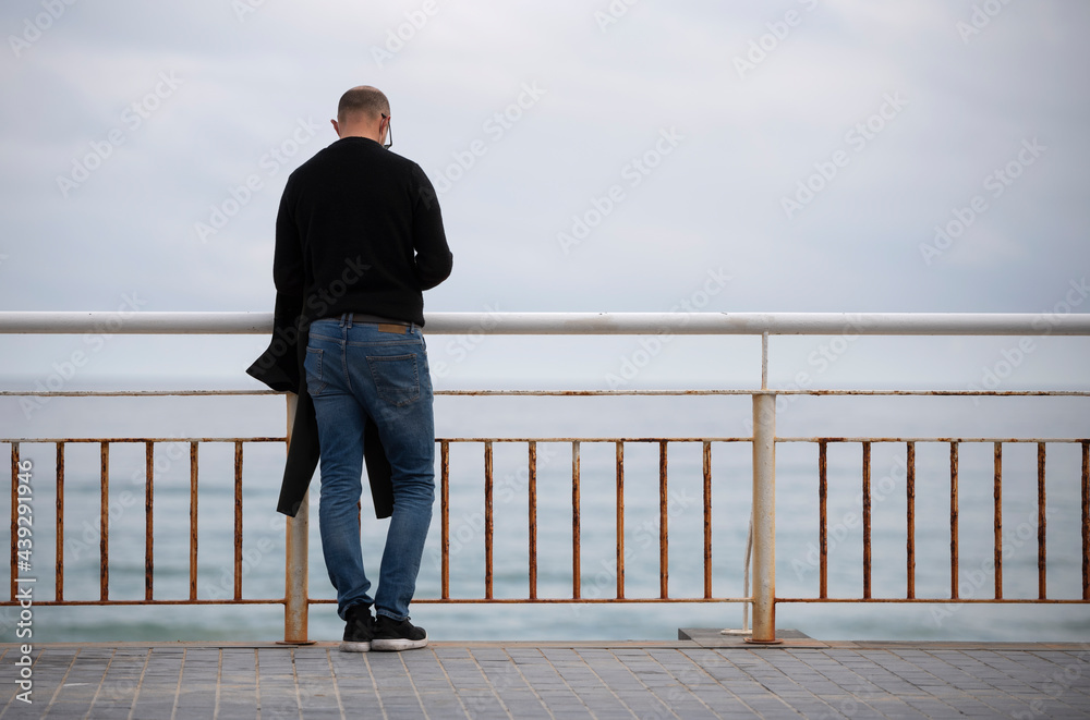 man thinking and relaxed near the sea