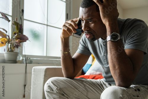 Принти на полотні Black guy talking phone with angry emotion