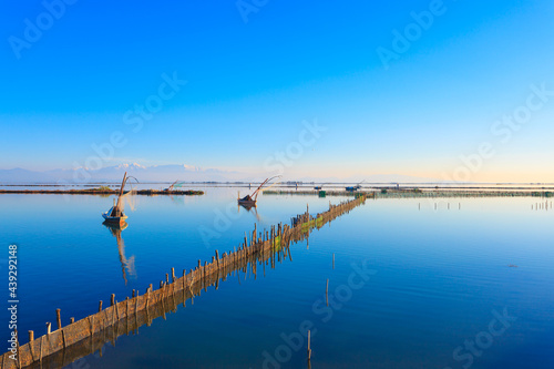 Greece traditional fishing boats in lake  at Winter time, Tourlida Greece photo