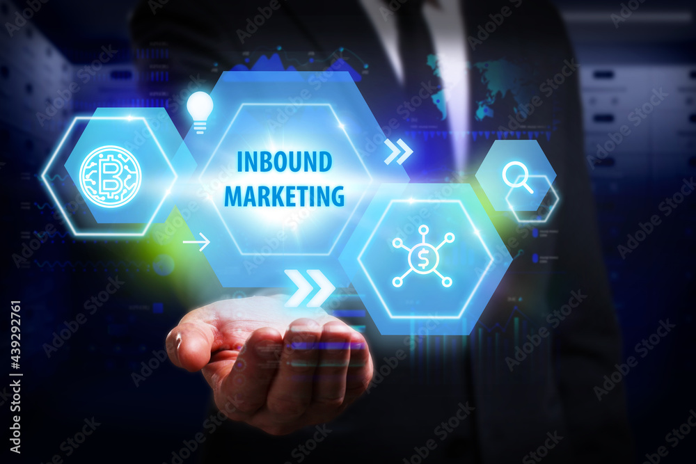 Business, Technology, Internet and network concept. Young businessman working on a virtual screen of the future and sees the inscription: Inbound marketing Business, Technology, Internet and network concept. Young businessman working on a virtual screen of the future and sees the inscription: Inbound marketing