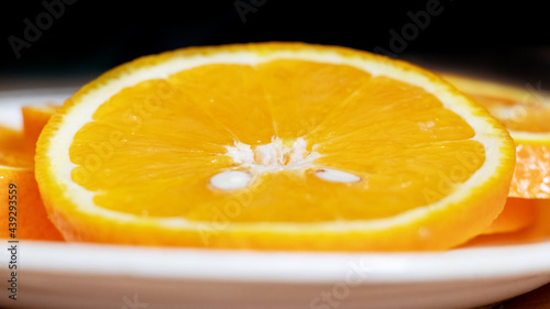 Sliced orange slices on a plate, citrus fruits