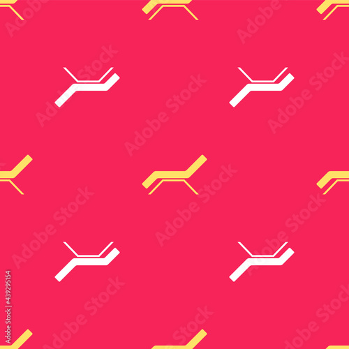 Yellow Sunbed icon isolated seamless pattern on red background. Sun lounger. Vector