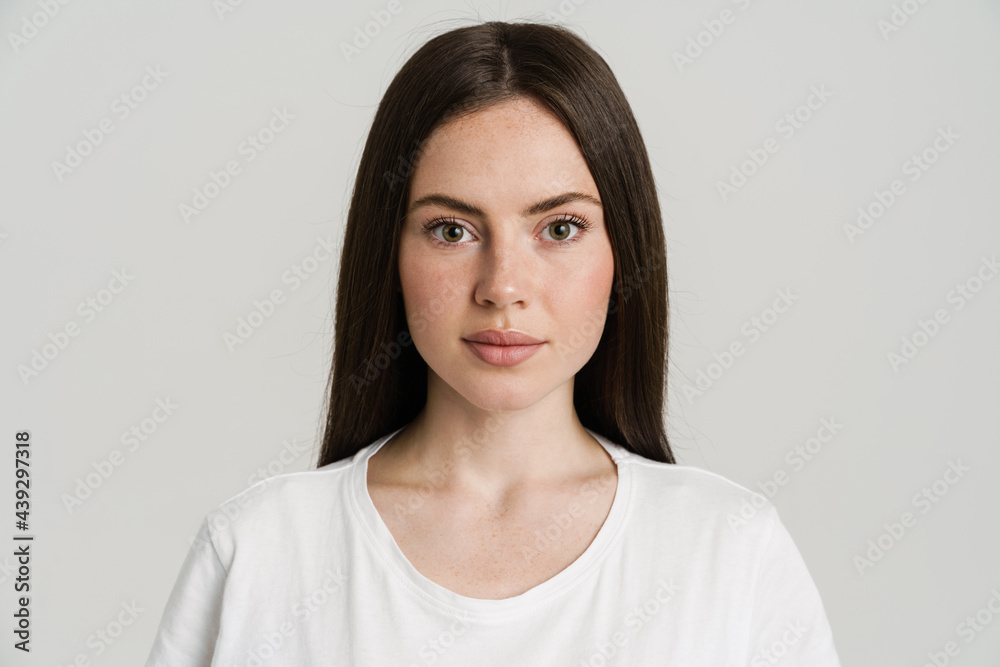 Young brunette woman posing and looking at camera Young brunette woman posing and looking at camera