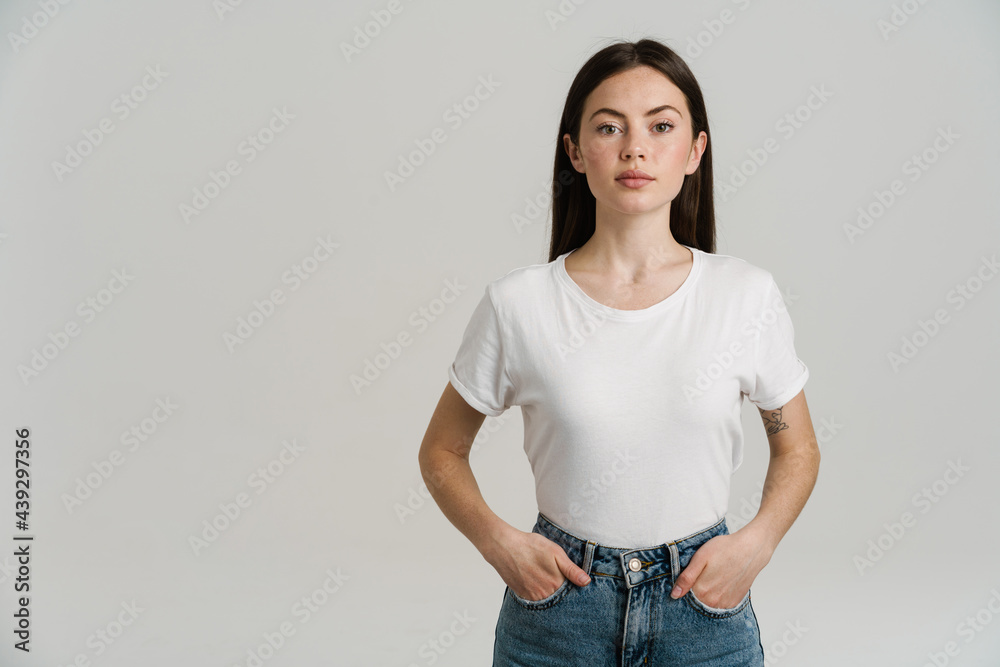 Young brunette woman posing and looking at camera Young brunette woman posing and looking at camera