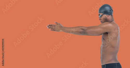 Composition of male swimmer with copy space isolated on orange background