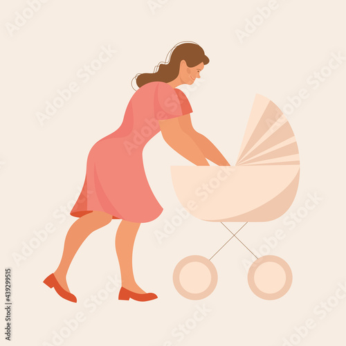 Happy mother with a pram. Walk with the newborn. Baby in a cradle. Caring for a newborn baby.