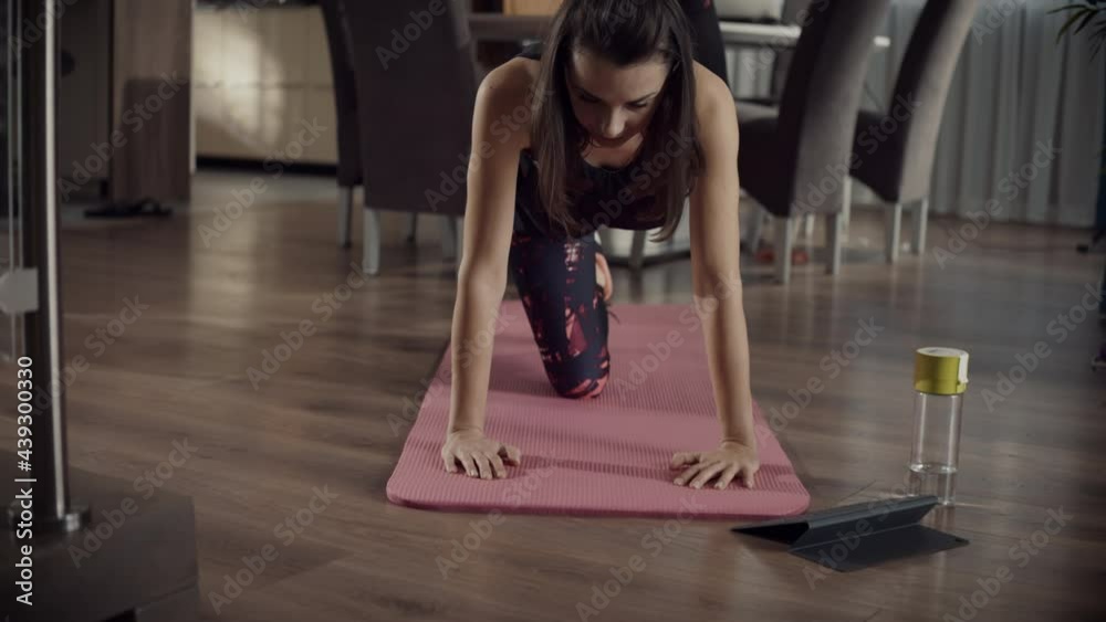 Young smiling woman doing some exercises at home Young smiling woman doing some exercises at home