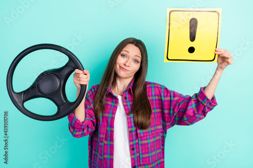 Photo of unsure straight hairdo young lady drive car hold warner wear checkered shirt isolated on vivid teal color background photo