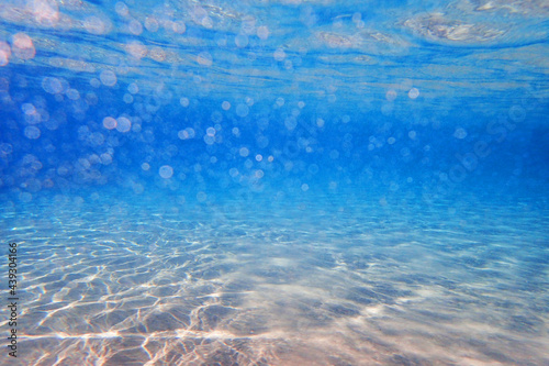 clear sand under sea water